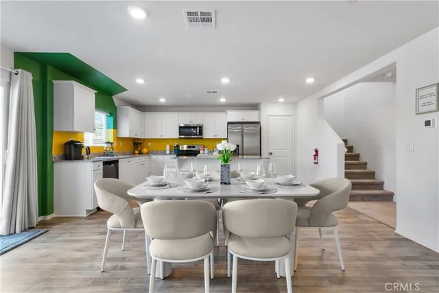 a view of kitchen dining table and chairs