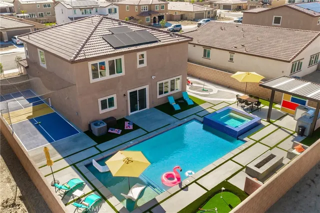 an aerial view of a house with a swimming pool