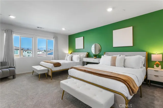 a bedroom with a bed and a couch