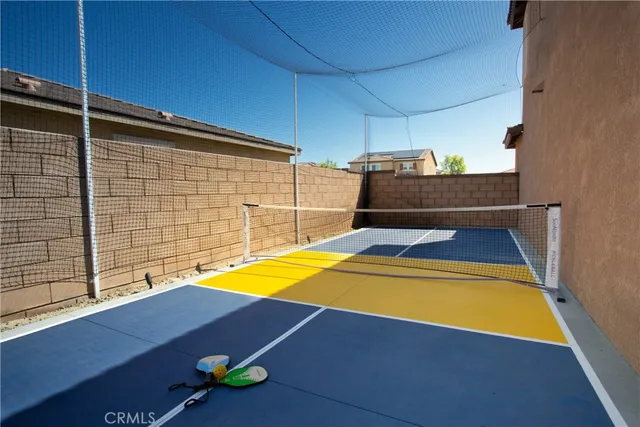 a view of a pool with chairs