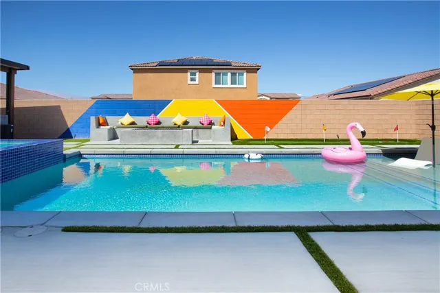 a room with pool table and window