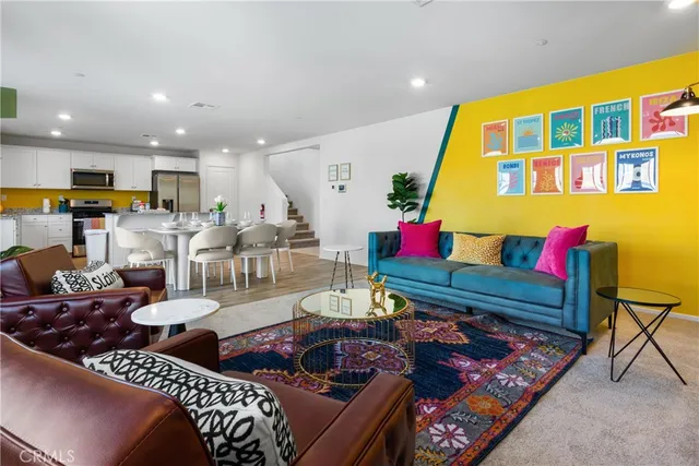 a living room with lots of furniture and a table