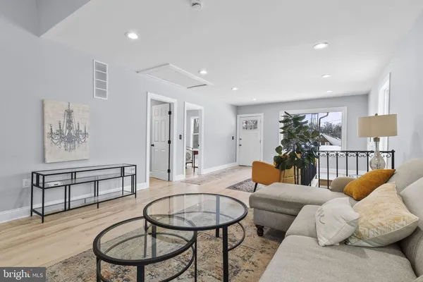 a living room with furniture and a table