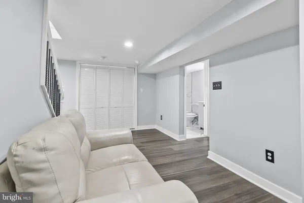 a living room with furniture and a rug