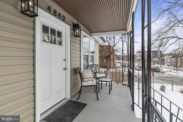 a patio with yard glass top table and chairs