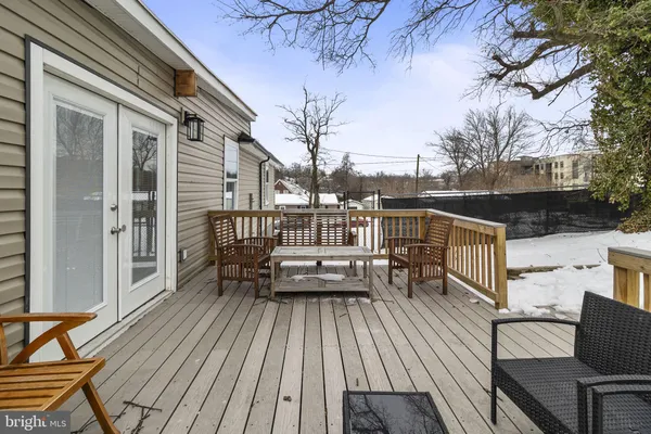 a view of roof deck with patio