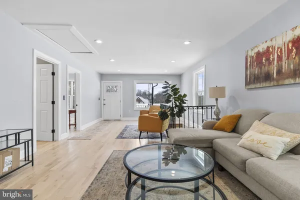 a living room with furniture and a table