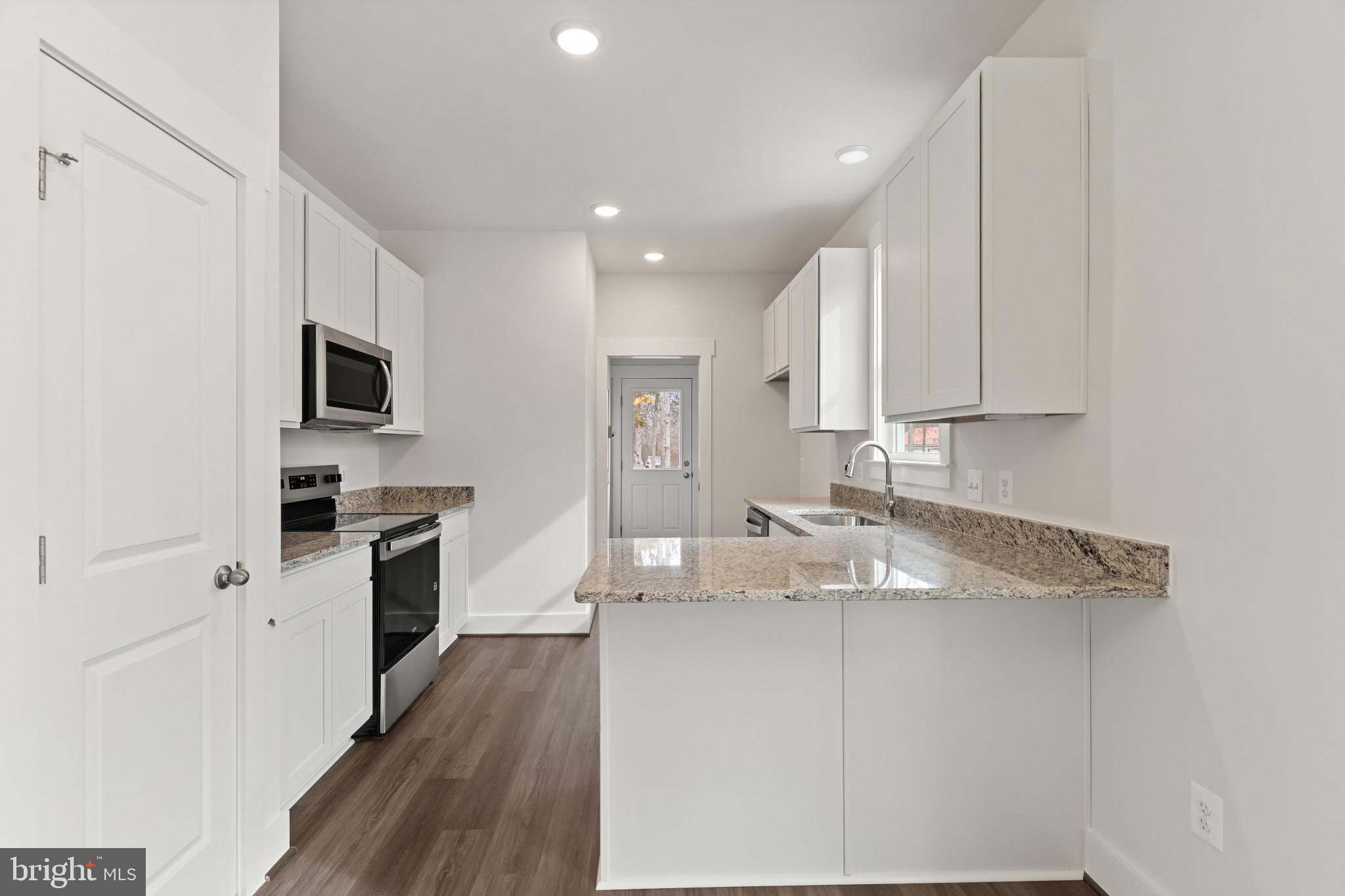 6735 Beverly Road Broad Run, VA 20137 - Photo 12 of 30 Kitchen with white cabinetry, stainless steel appl