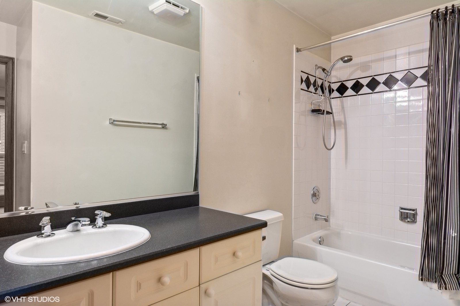 1447 South Indiana Avenue Chicago, IL 60605 - Photo 21 of 23 a bathroom with a granite countertop sink toilet and shower