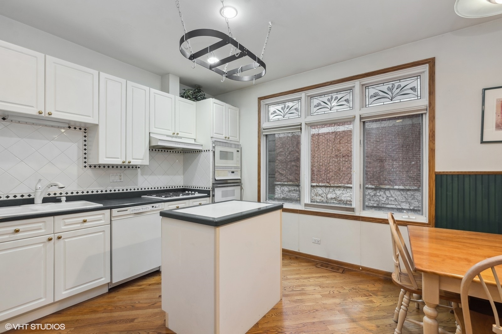 1447 South Indiana Avenue Chicago, IL 60605 - Photo 8 of 23 a kitchen with stainless steel appliances granite countertop a stove and cabinets