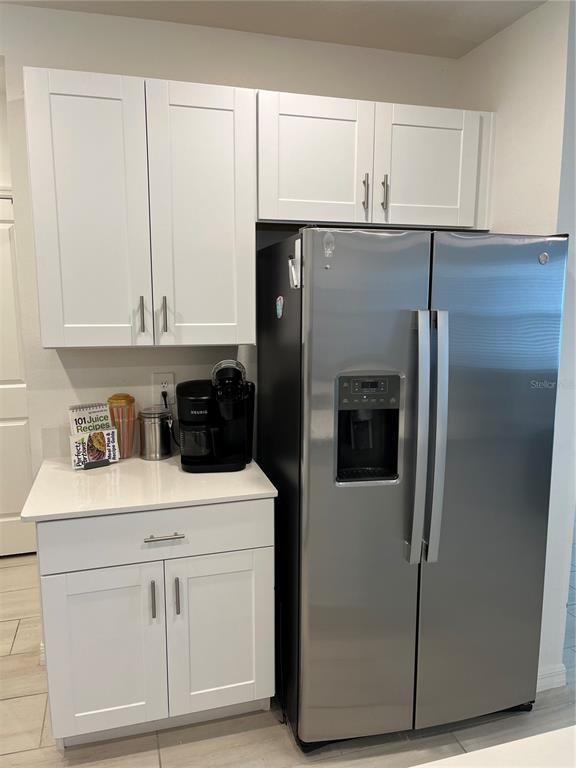 34780 Rainville Loop Zephyrhills, FL 33541 - Photo 19 of 30 a kitchen with a sink and white cabinets