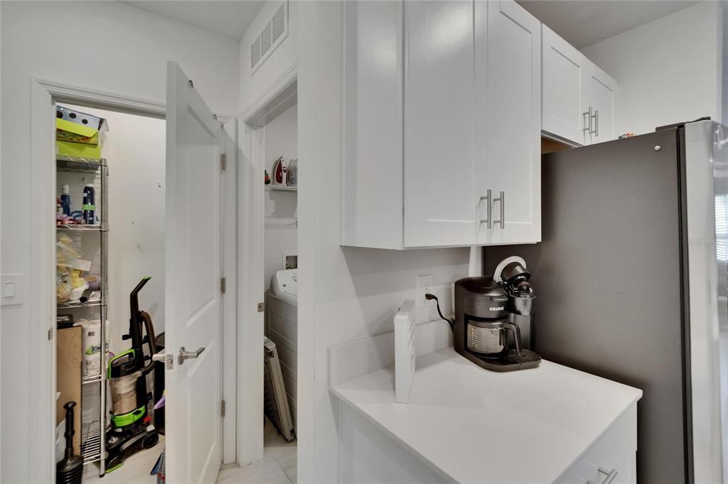 34780 Rainville Loop Zephyrhills, FL 33541 - Photo 20 of 30 a kitchen with a refrigerator and a sink