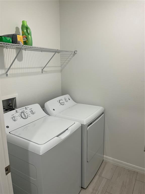 34780 Rainville Loop Zephyrhills, FL 33541 - Photo 21 of 30 a utility room with dryer and washer