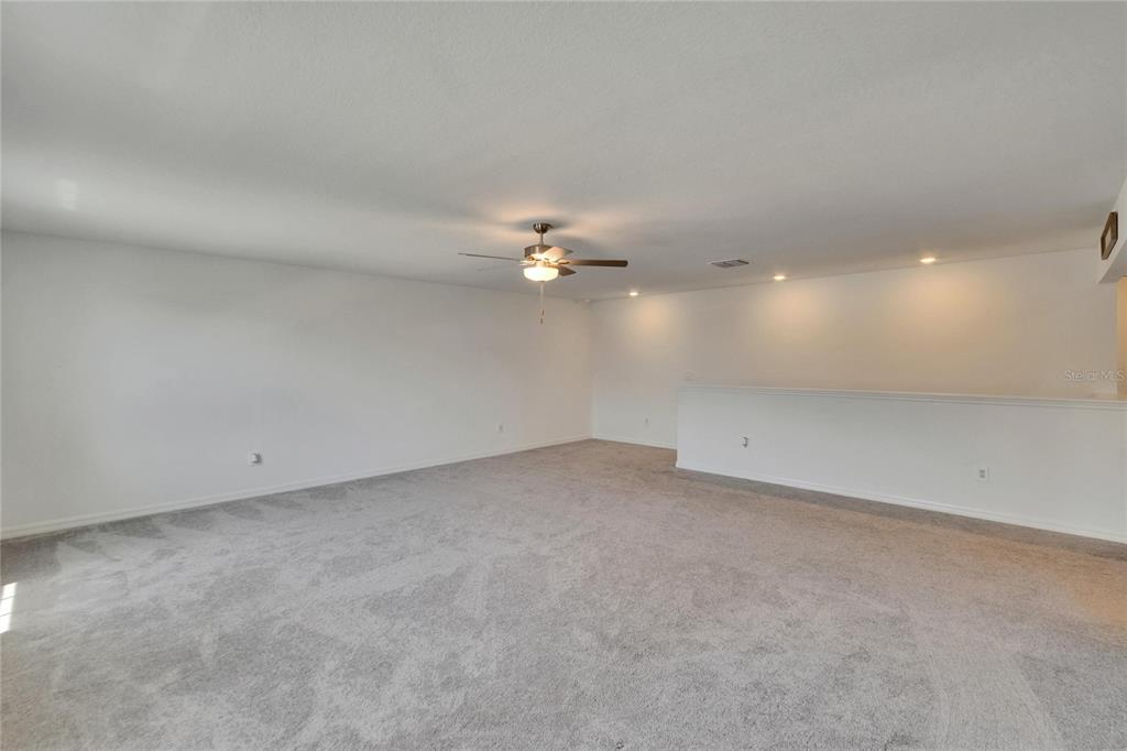34780 Rainville Loop Zephyrhills, FL 33541 - Photo 23 of 30 a view of a room with a ceiling fan