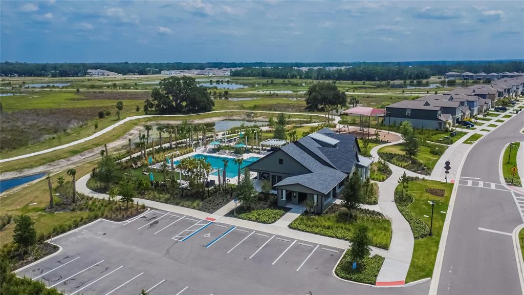 34780 Rainville Loop Zephyrhills, FL 33541 - Photo 6 of 30 a view of a lake with a table and chairs