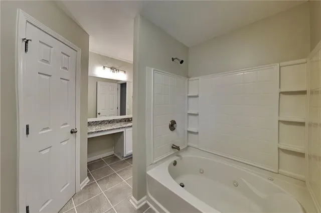 a bathroom with a bathtub and a sink