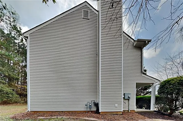 a view of a white house with many windows