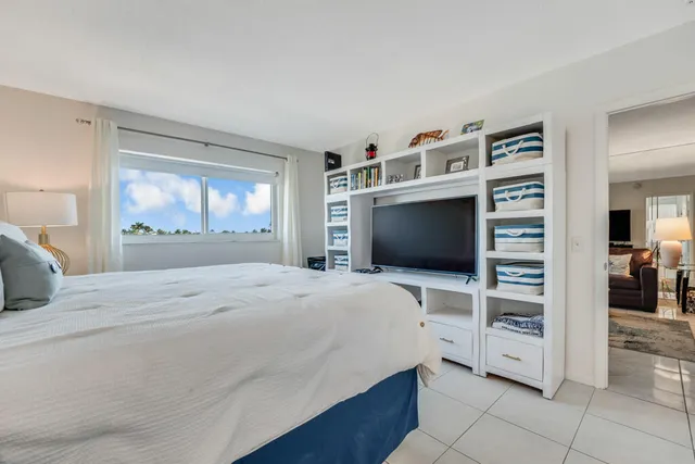 a bed room with a bed and a walk in closet