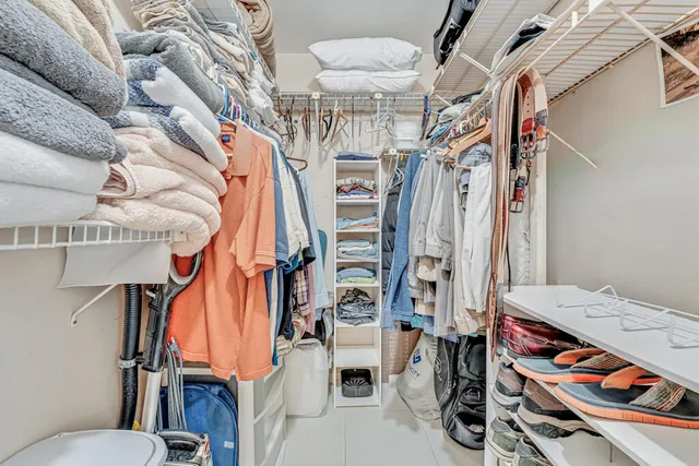 a bathroom with a toilet sink shower and mirror