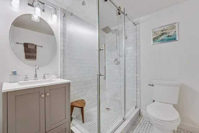 a bedroom with a bed and a chair