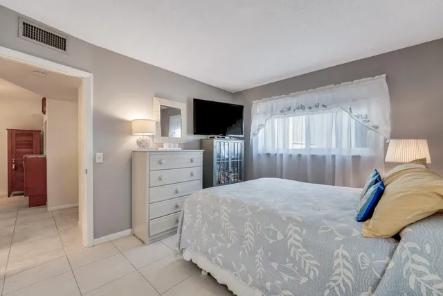 a bathroom with a toilet sink and shower