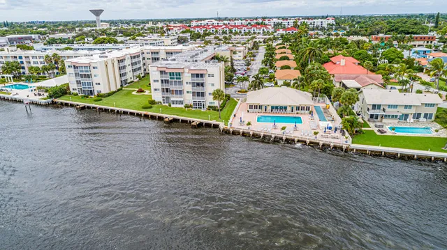 an aerial view of a balcony with chairs