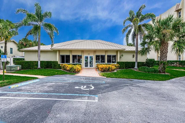 a view of a building with a backyard