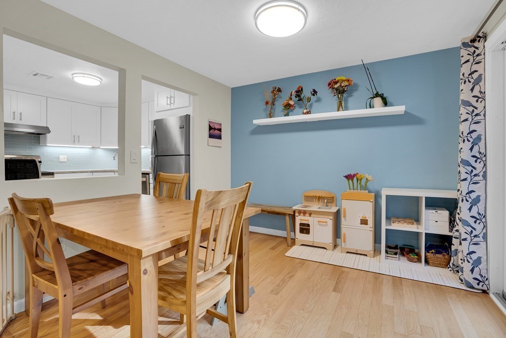 214 Ridgefield Circle, Unit B Clinton, MA 01510 - Photo 12 of 32 a view of a dining room with furniture and wooden floor