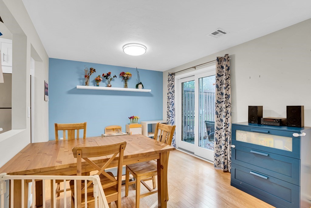 214 Ridgefield Circle, Unit B Clinton, MA 01510 - Photo 13 of 32 a view of a dining room with furniture window and wooden floor