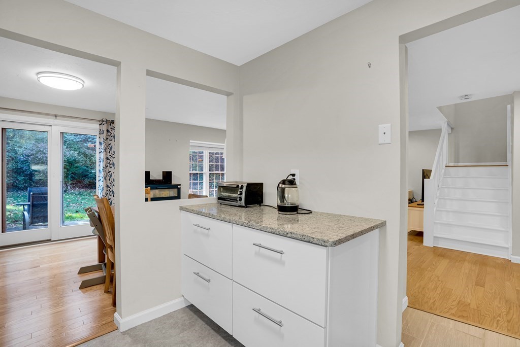 214 Ridgefield Circle, Unit B Clinton, MA 01510 - Photo 18 of 32 a view of living room with granite countertop furniture and floor to ceiling window