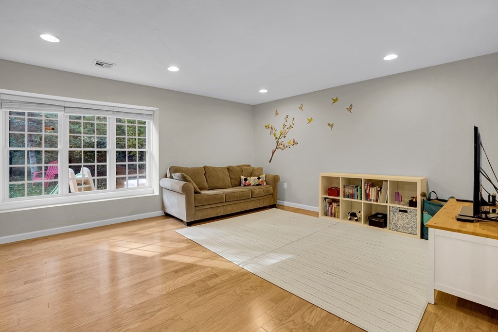 214 Ridgefield Circle, Unit B Clinton, MA 01510 - Photo 2 of 32 a living room with furniture and a flat screen tv