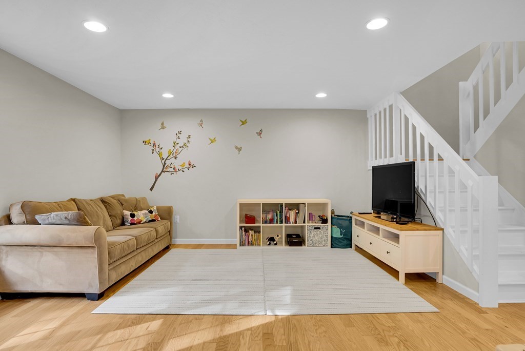 214 Ridgefield Circle, Unit B Clinton, MA 01510 - Photo 3 of 32 a living room with furniture and a flat screen tv