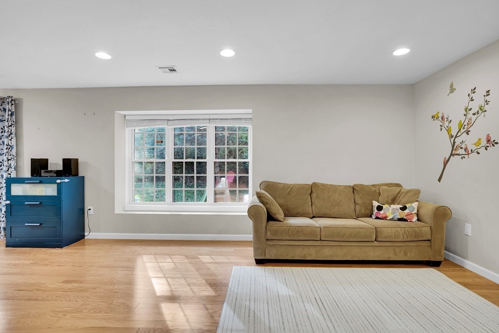 214 Ridgefield Circle, Unit B Clinton, MA 01510 - Photo 5 of 32 a living room with furniture and a window