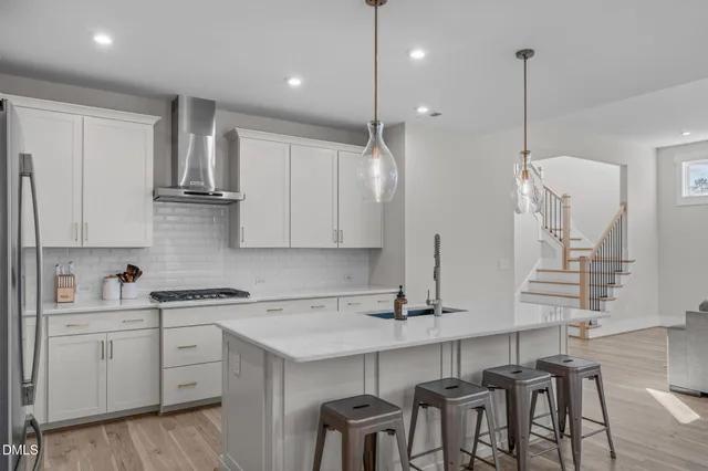 a kitchen with a sink cabinets and window
