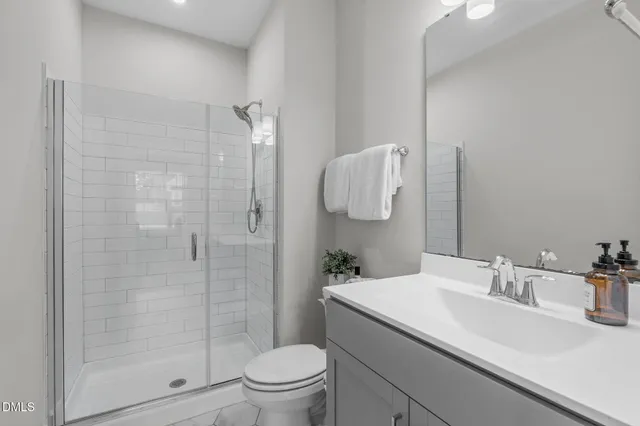 a bedroom with a large bed and a desk