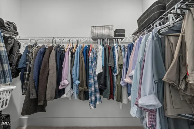 a bathroom with a granite countertop sink double vanity and mirror