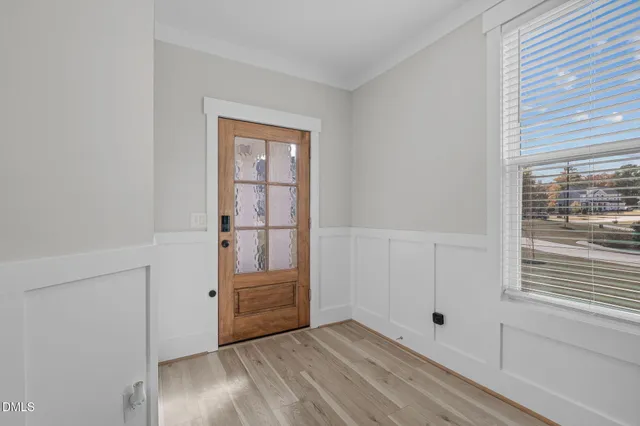 a room with a sink and wooden floor