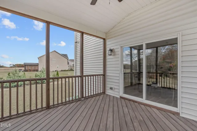 a view of a balcony with wooden floor