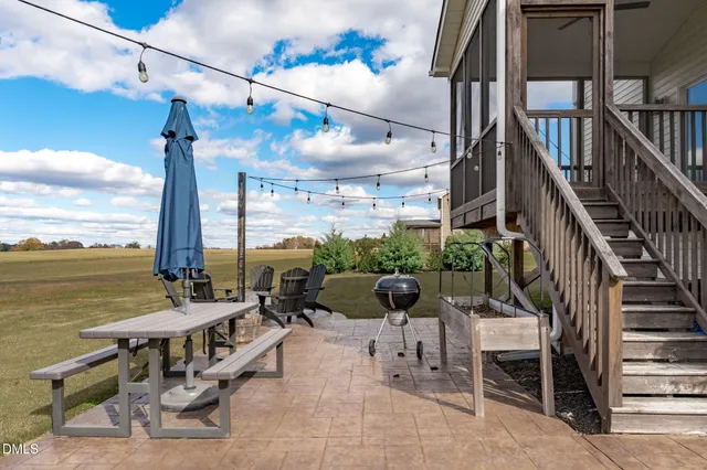 a view of a patio with couches and pool table