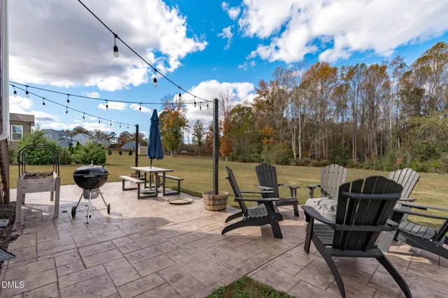 a view of a patio with a yard