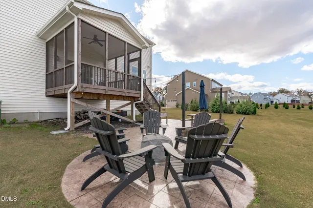 a view of a chairs and table in patio
