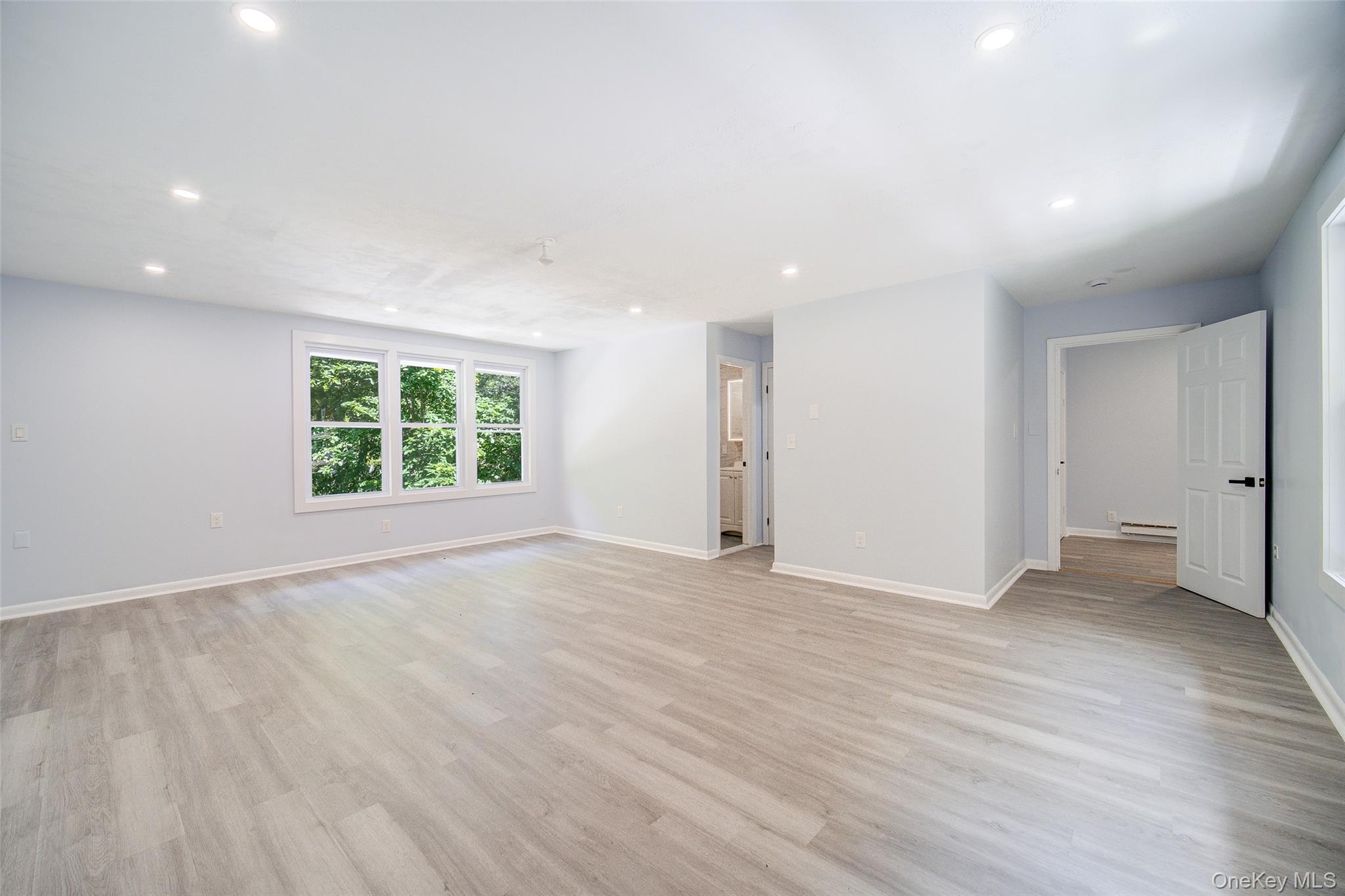 219 Benedict Road Montgomery, NY 12549 - Photo 28 of 50 an empty room with wooden floor and windows