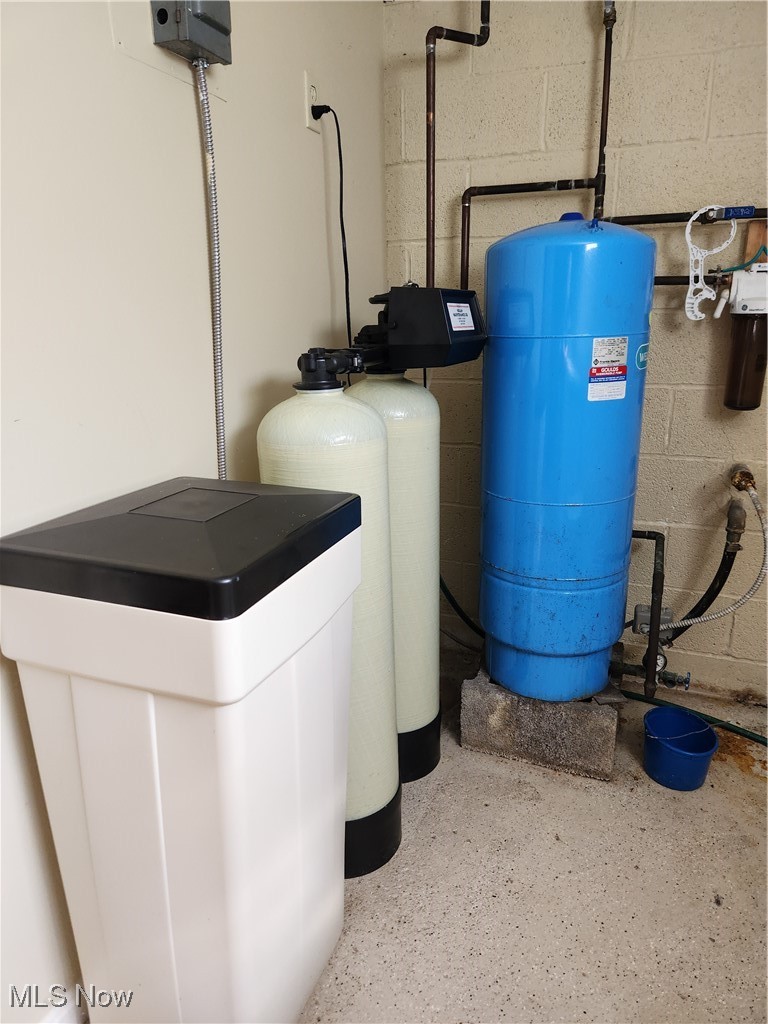 9170 Cedar Road Chesterland, OH 44026 - Photo 22 of 29 Water Softener Equipment in Separate Storage Room off of the Rec Rm