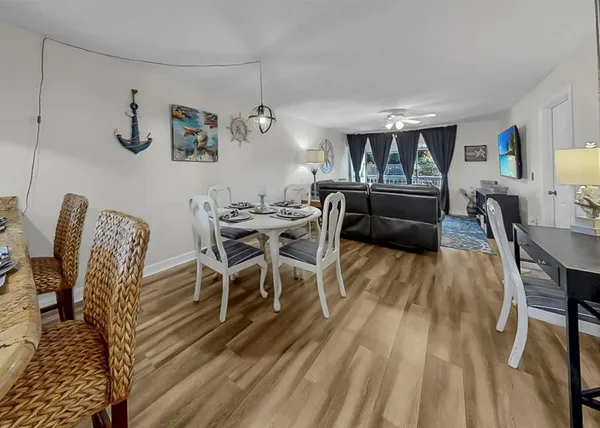 a living room with fireplace furniture and a flat screen tv