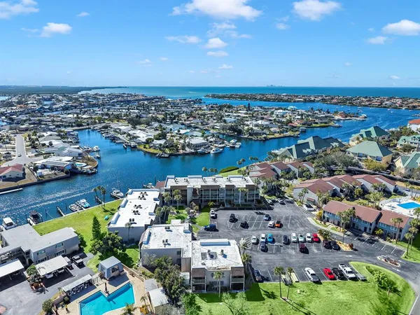 an aerial view of residential building and ocean