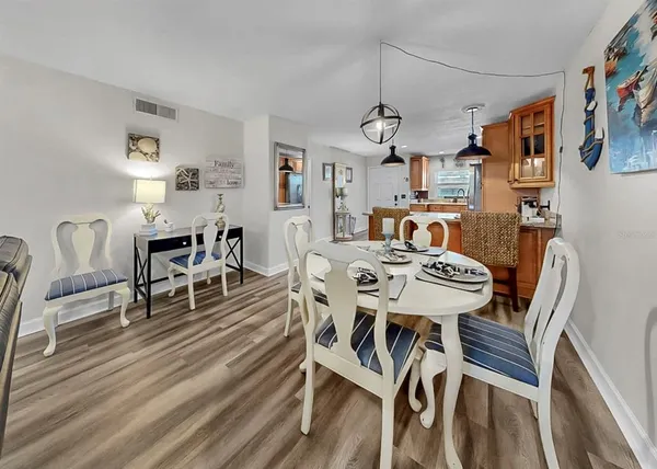 a kitchen with stainless steel appliances granite countertop a refrigerator stove top oven and sink