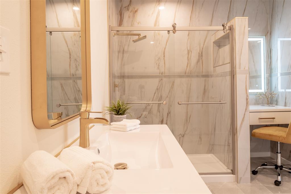 210 Davis Road Granbury, TX 76049 - Photo 13 of 28 a bathroom with a bathtub and a shower