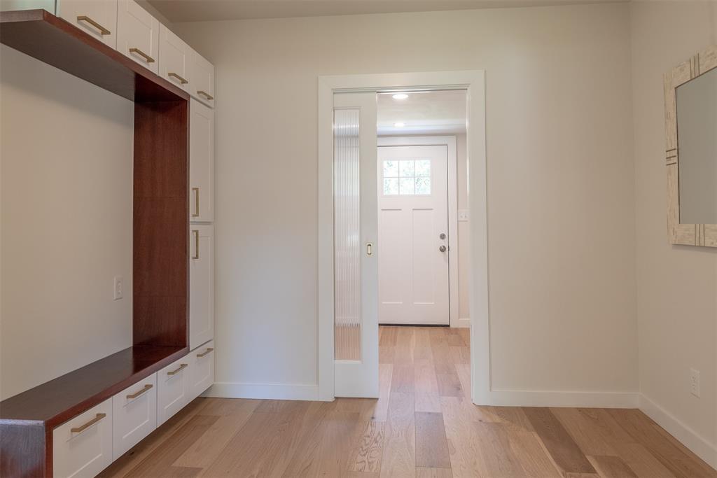 210 Davis Road Granbury, TX 76049 - Photo 15 of 28 a view of an empty room with wooden floor