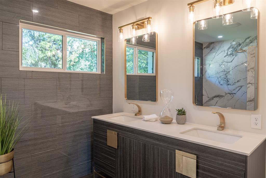 210 Davis Road Granbury, TX 76049 - Photo 18 of 28 a bathroom with a double vanity sink and a mirror