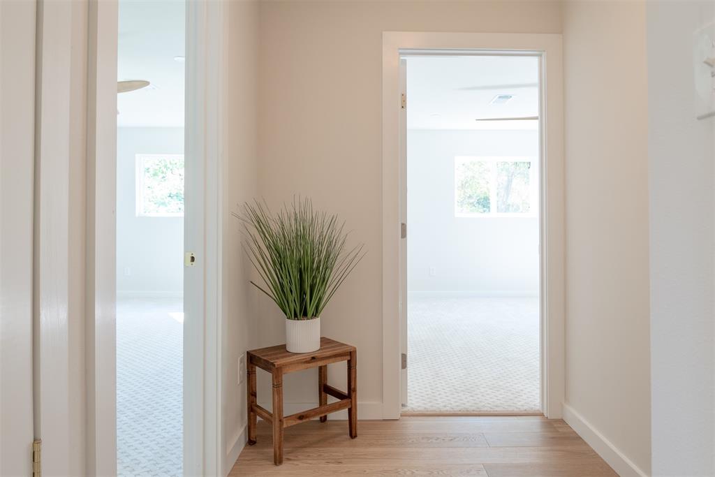 210 Davis Road Granbury, TX 76049 - Photo 20 of 28 a room with a bench and potted plants